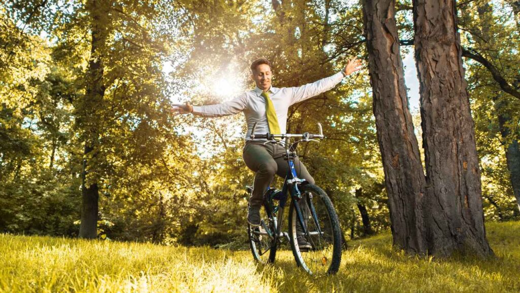 a man in a jungle balancing on a cycle